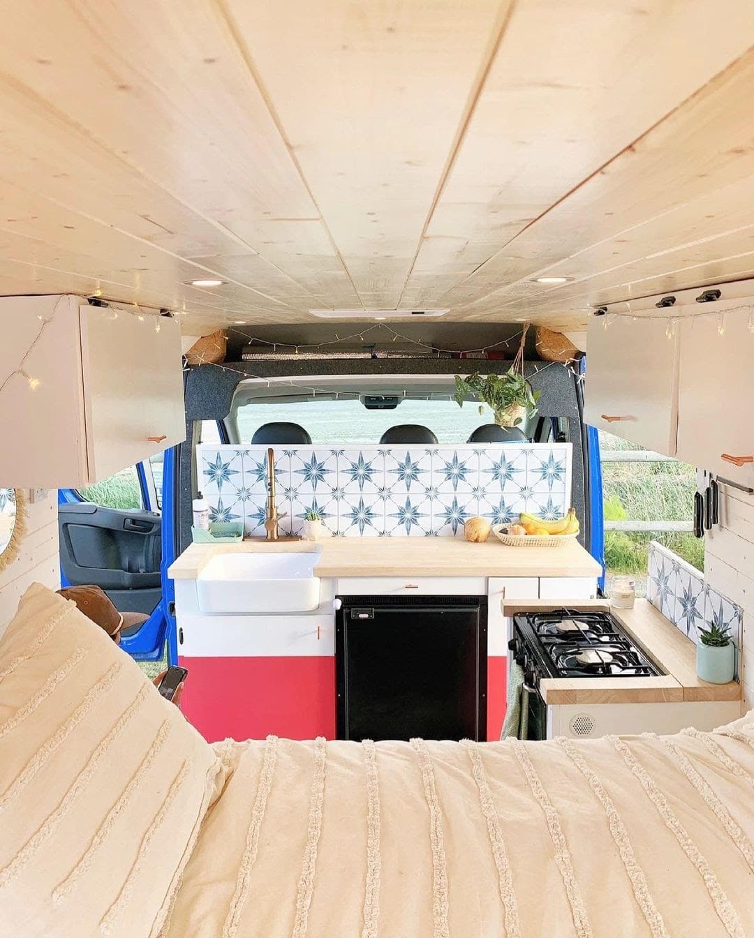 Camper Van Kitchen Layouts with a bed